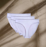 Three pairs of Kiseau Organic Cotton Bikini Underwear in soft neutral tone, sustainable and breathable natural fabric.