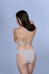Woman wearing Kiseau organic cotton Brazilian underwear for women, breathable sustainable fabric, back view.