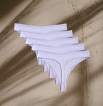 Five pairs of Kiseau Organic Cotton Thong Underwear in natural hue, breathable and toxin-free minimalist essentials.
