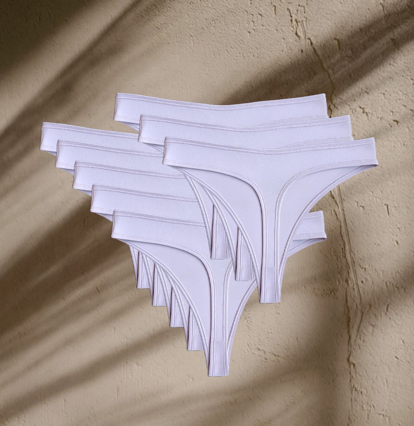 Seven pairs of Kiseau Organic Cotton Thong Underwear, sustainable, lightweight, and ethically made in small batches.