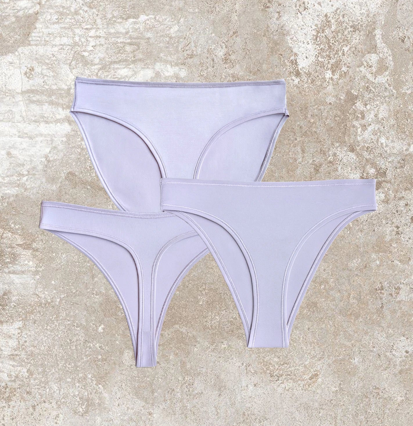 Floating display of Kiseau organic cotton underwear in three styles, sustainable breathable fabric, minimalist discovery set design.