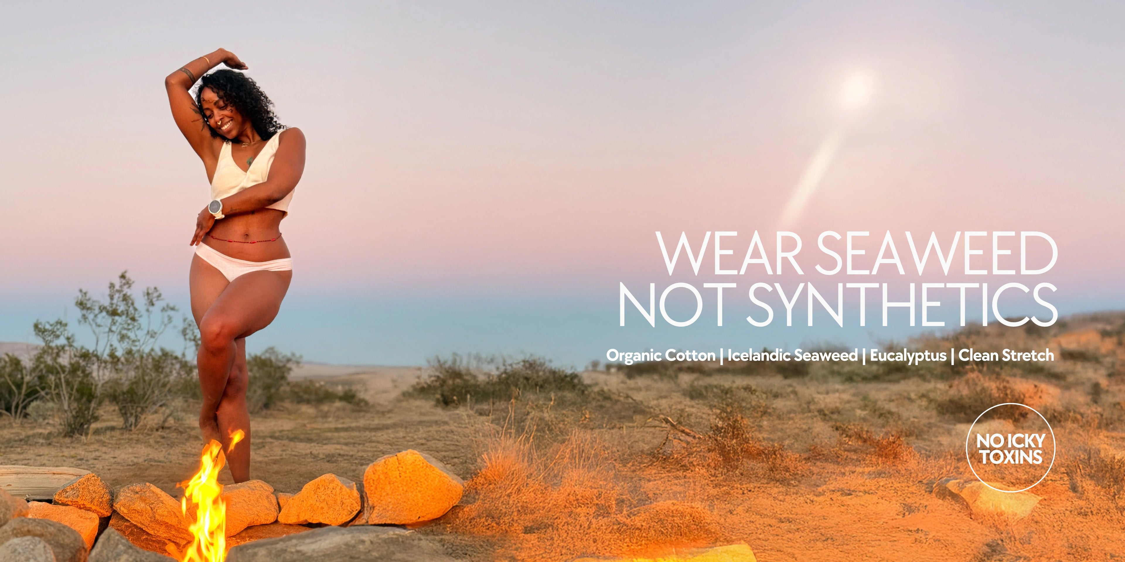 Model wearing Kiseau organic cotton and Icelandic seaweed underwear outdoors at sunset, embodying natural materials, toxin-free comfort, and freedom of movement.