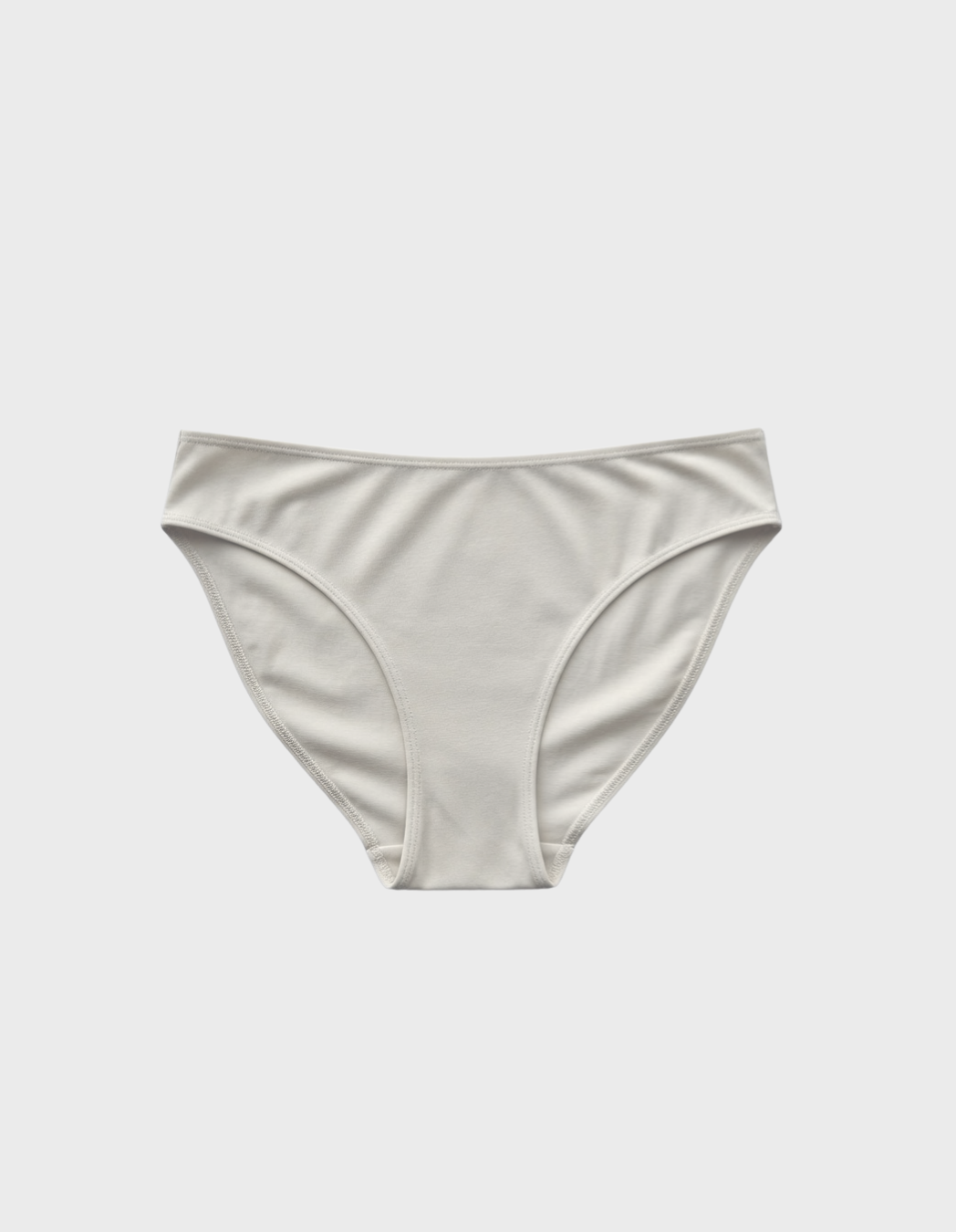 Kiseau cheeky bikini underwear in natural undyed beige — sustainable women's underwear made from Icelandic seaweed-infused organic cotton, flat lay front view