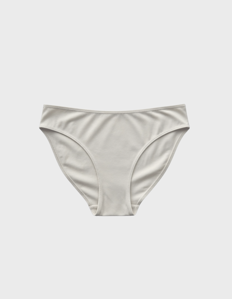 Kiseau cheeky bikini underwear in natural undyed beige — sustainable women's underwear made from Icelandic seaweed-infused organic cotton, flat lay front view