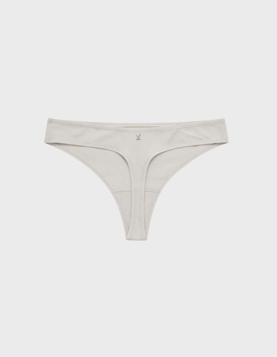 Kiseau classic thong underwear in natural undyed beige — sustainable women's underwear made from Icelandic seaweed-infused organic cotton, flat lay back view