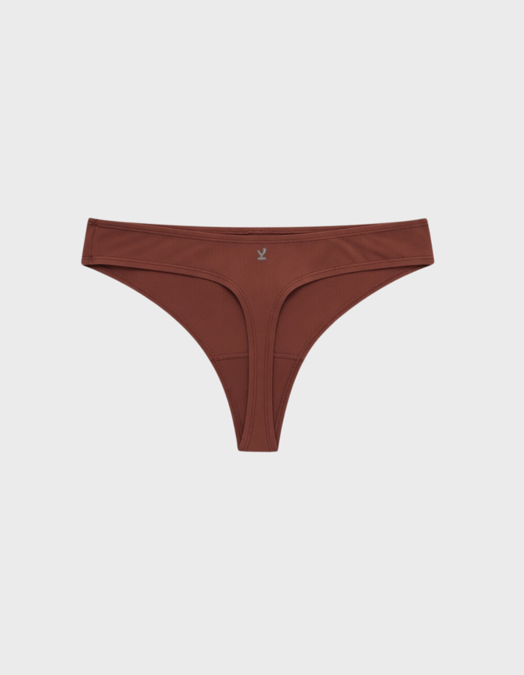 Kiseau classic thong underwear in terra cotta — sustainable women's underwear made from Icelandic seaweed-infused organic cotton, flat lay back view