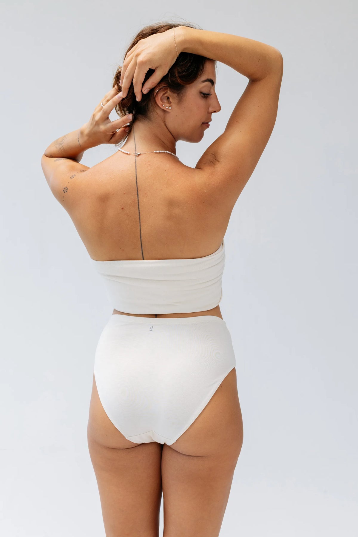 Kiseau Natural Undyed High Waist Brief back view with Kiseau logo tag — seaweed organic cotton underwear