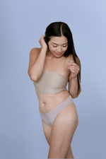 Woman wearing Kiseau organic cotton Brazilian underwear for women, sustainable breathable design, side view.