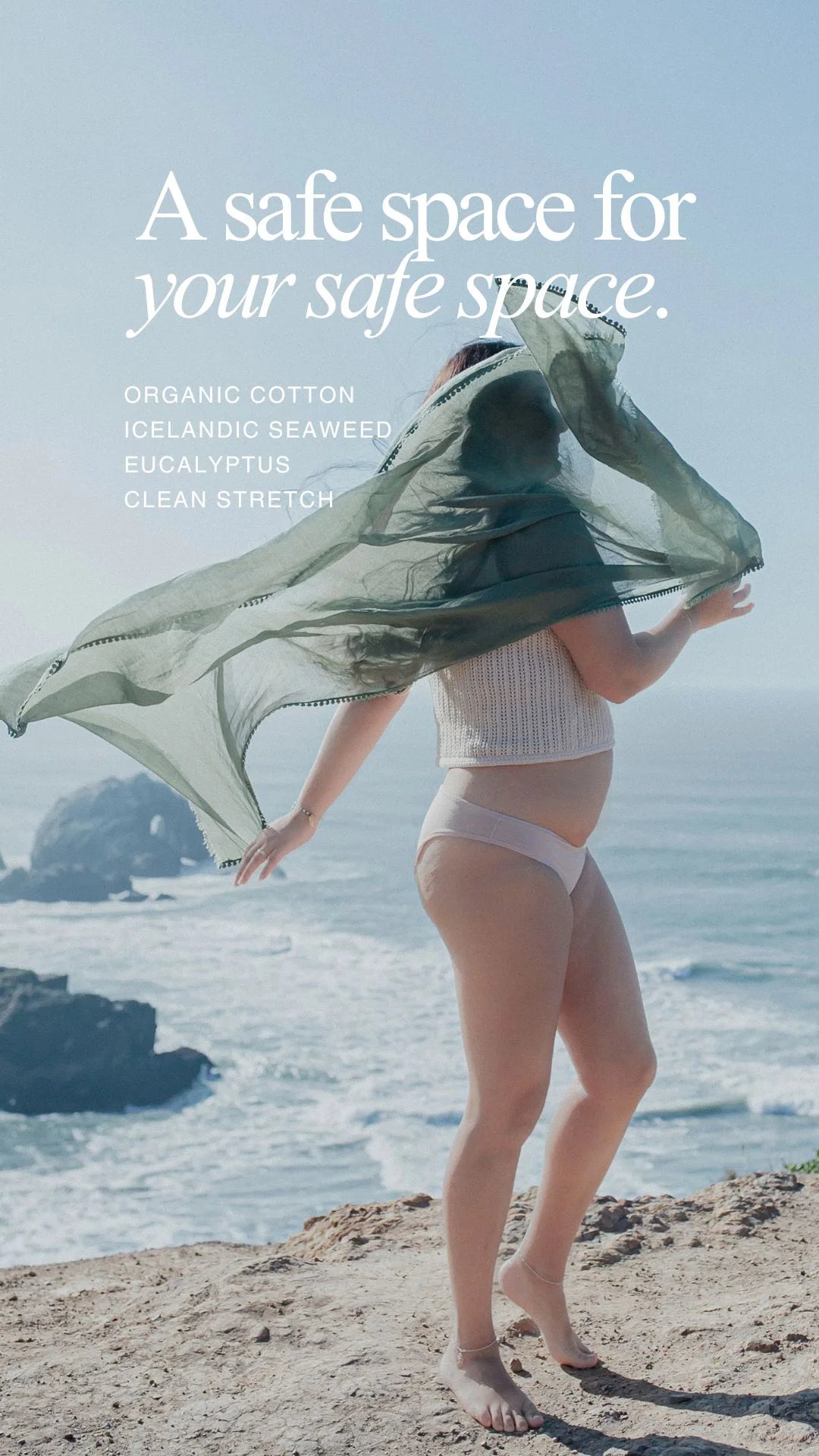 Model wearing Kiseau organic cotton and Icelandic seaweed underwear standing on an ocean cliff, representing breathable, non-toxic underwear designed as a safe space for intimate skin.