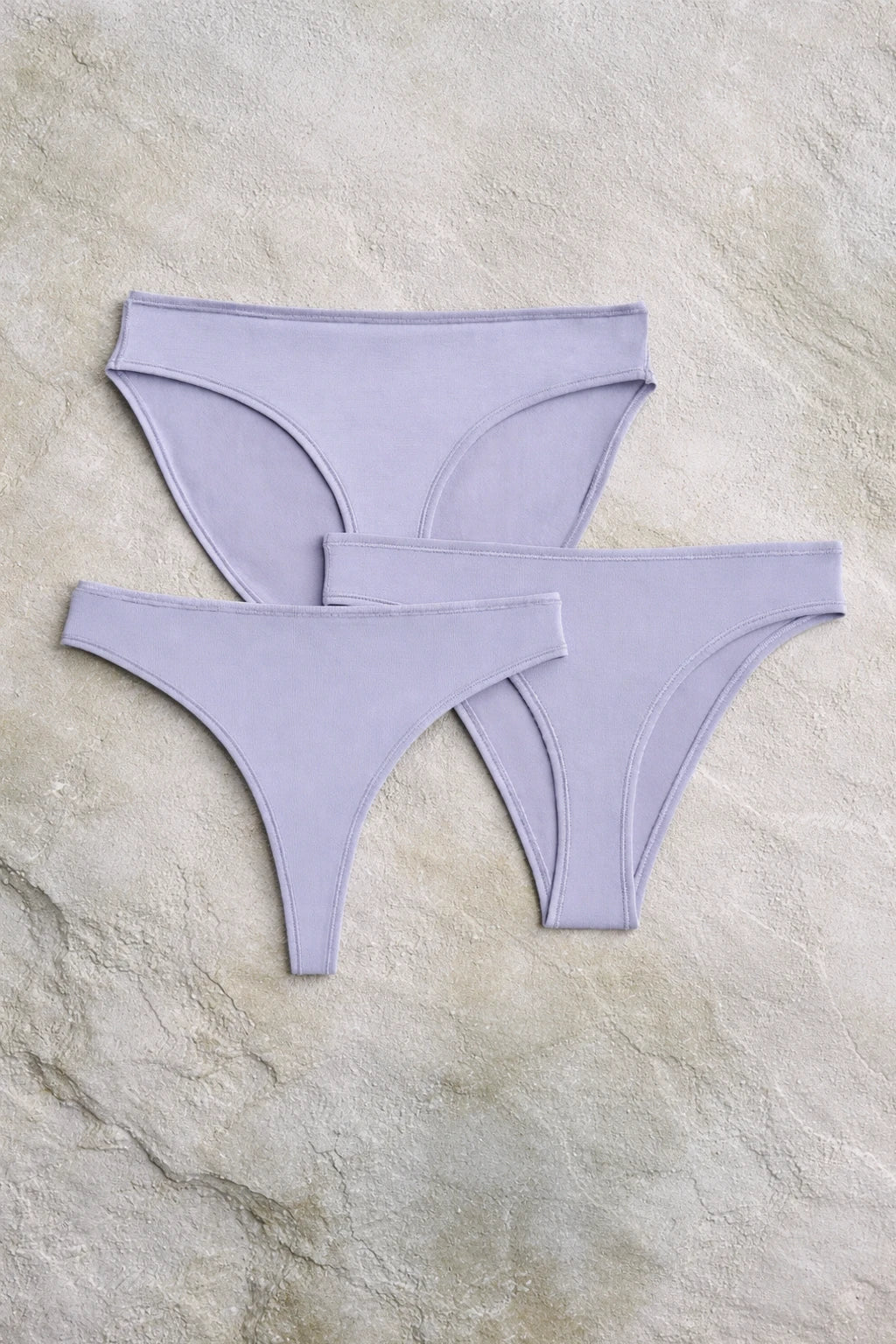 Three-piece set of Kiseau organic cotton and seaweed underwear in a soft lilac shade, designed to be breathable, non-toxic, and gentle on skin.