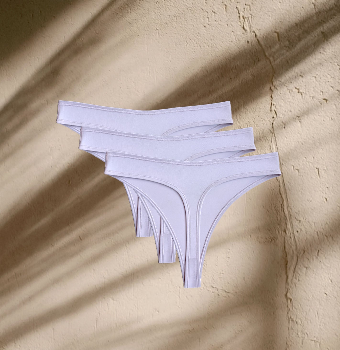 Three pairs of Kiseau Organic Cotton Thong Underwear, soft, elastic-free, and sustainably crafted for everyday comfort.