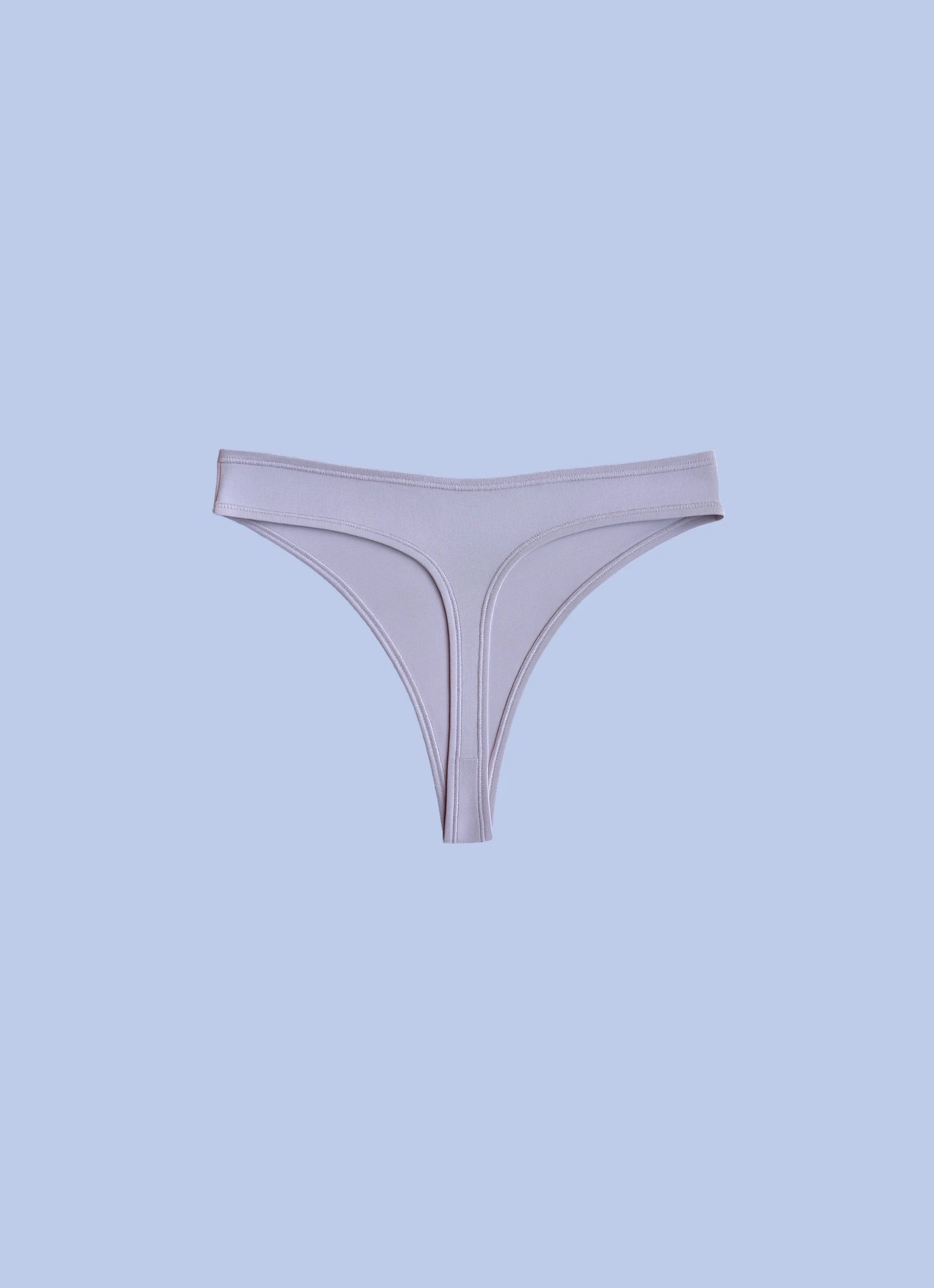 Kiseau organic cotton thong underwear for women, eco-friendly breathable fabric, back view flat lay.
