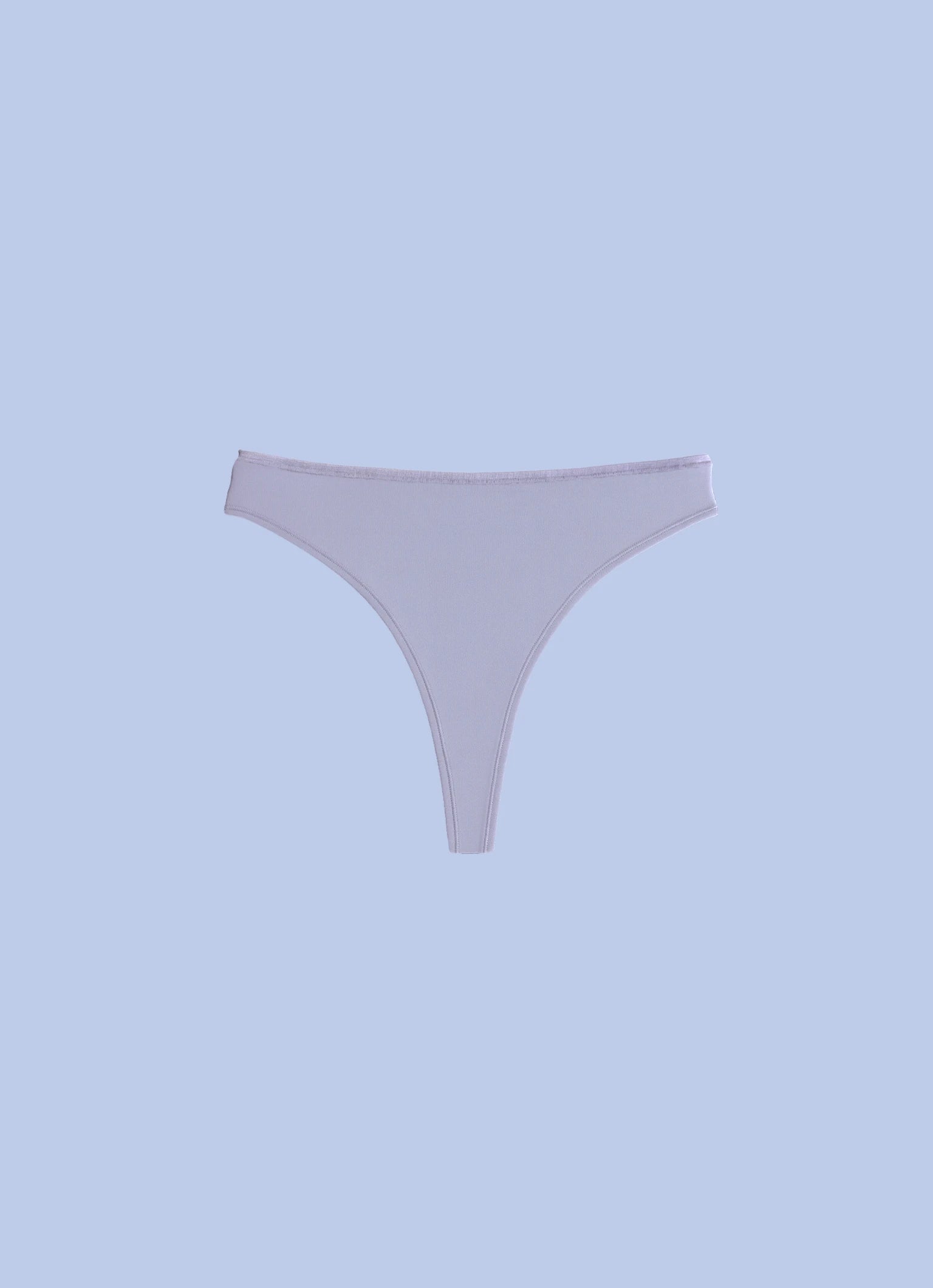 Kiseau organic cotton thong underwear for women, sustainable breathable fabric, front view flat lay.