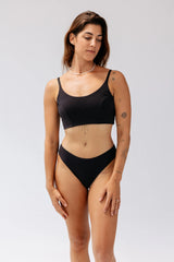 Model wearing Kiseau Charcoal Bralette and Cheeky Bikini, front view