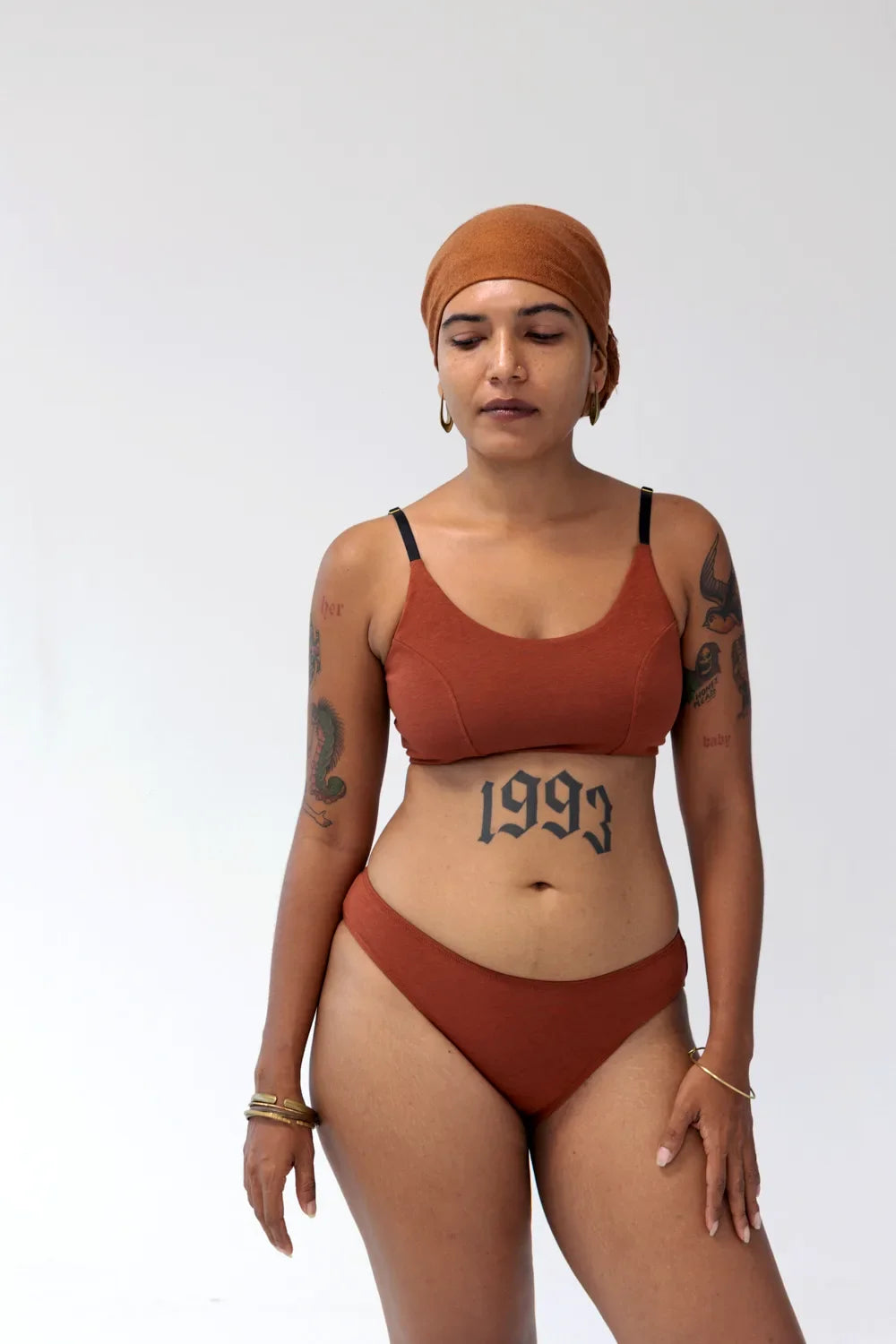 Model wearing Kiseau Terra Cotta Bralette and Cheeky Bikini, front view