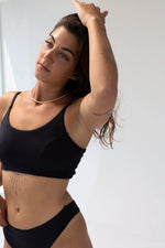 Model wearing Kiseau Charcoal Bralette and Classic Thong, close up fit