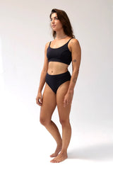 Model wearing Kiseau Charcoal Bralette and High Waist Brief, front view