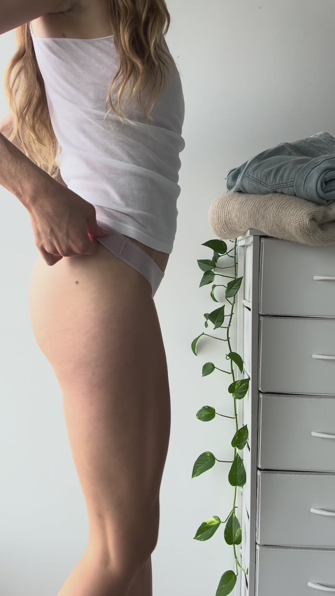 Customer showing the side fit of Kiseau organic cotton and seaweed underwear, demonstrating the mid-rise waist, soft seams, and smooth, breathable fabric.